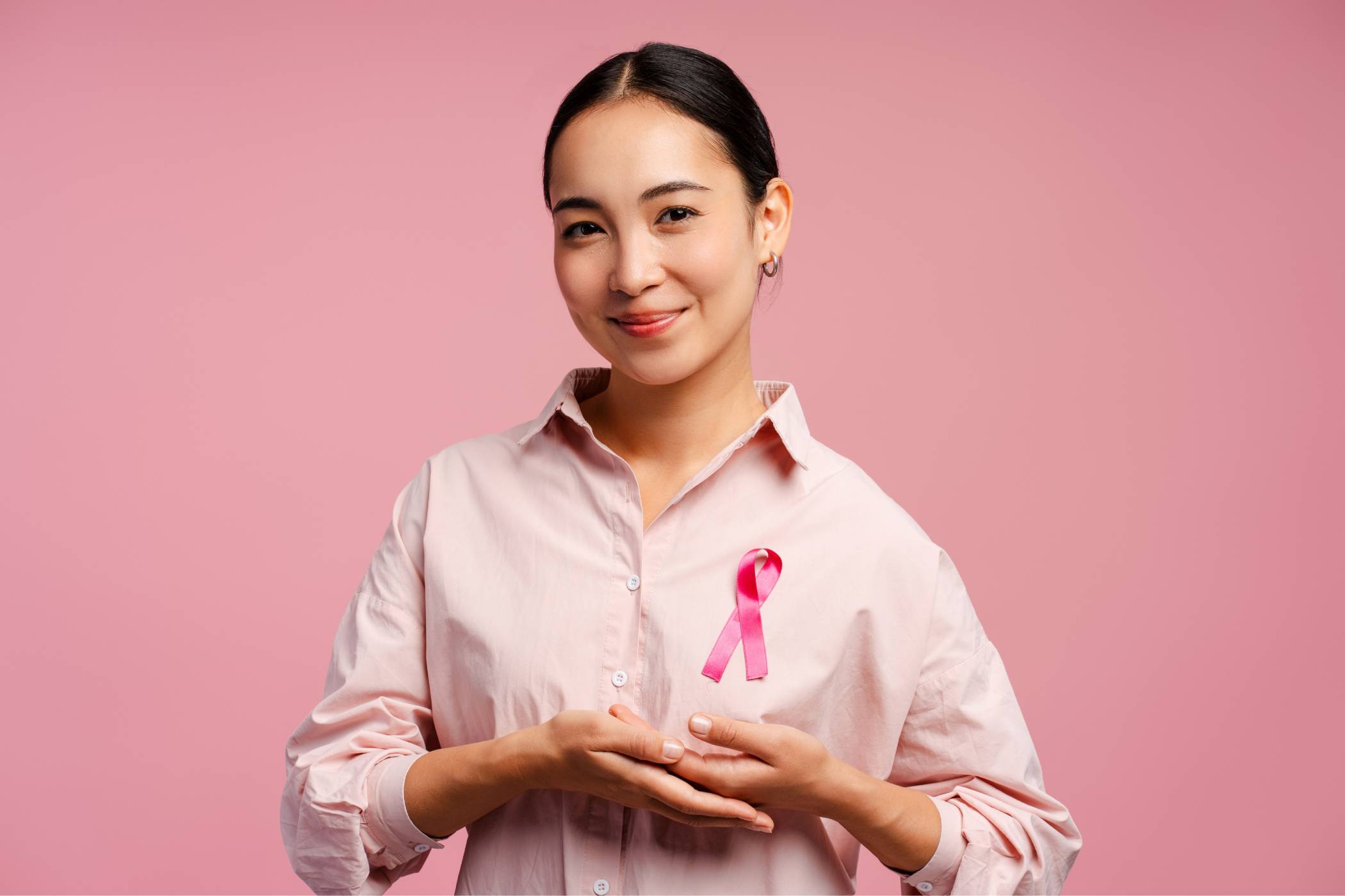 Woman with breast cancer awareness badge