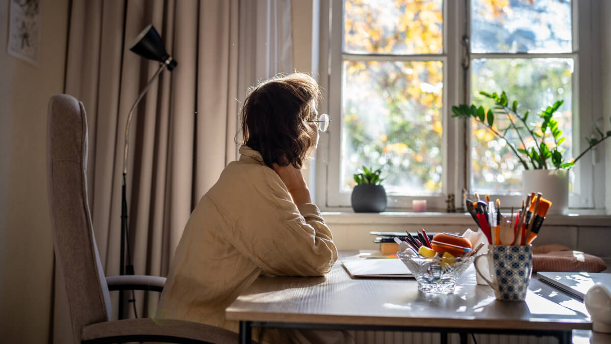 Woman looking out of window