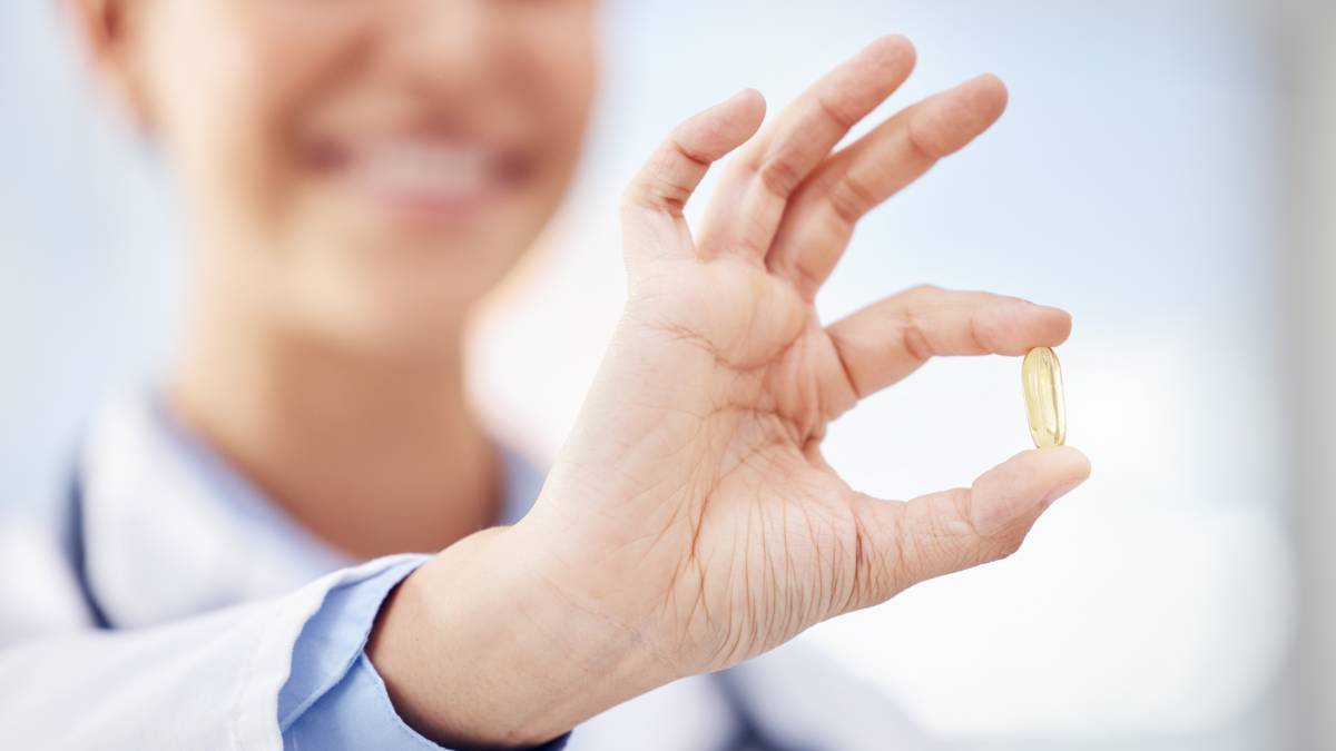 Doctor holding supplement