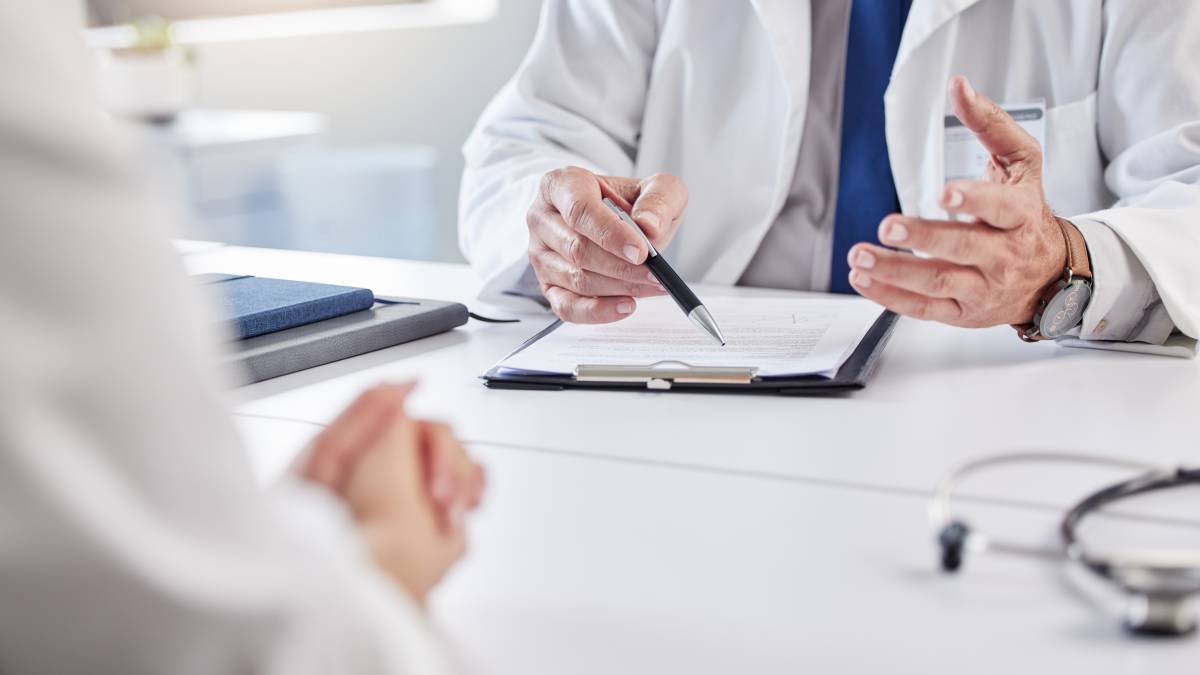 Doctor with pen and clipboard
