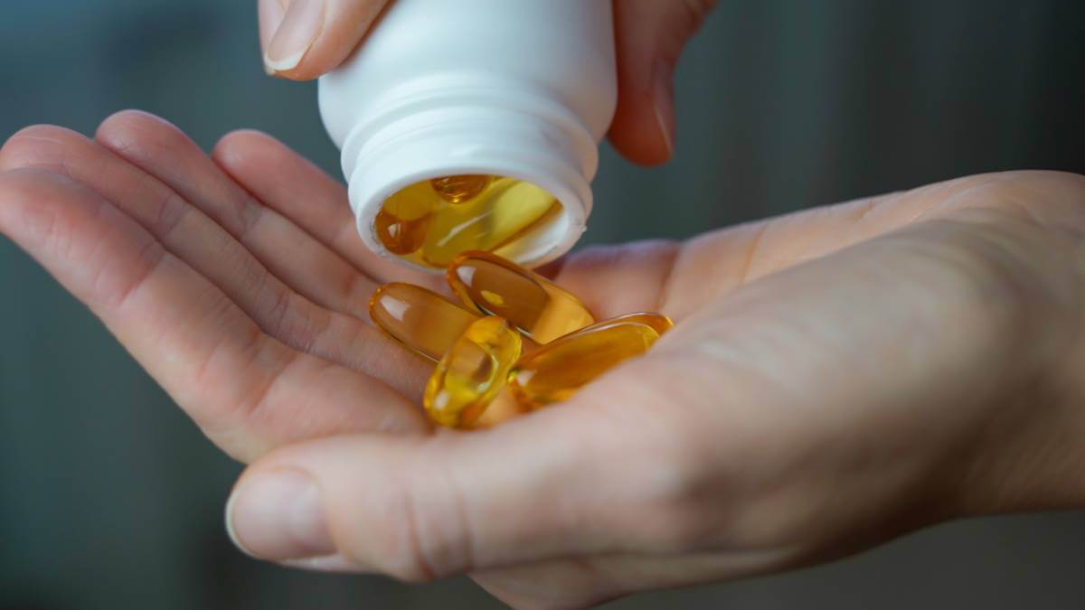 Supplements being poured into hand